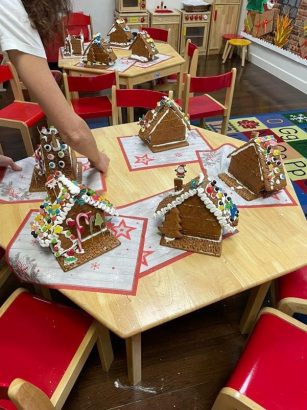 Early Years & Primary students make gingerbread houses Image
